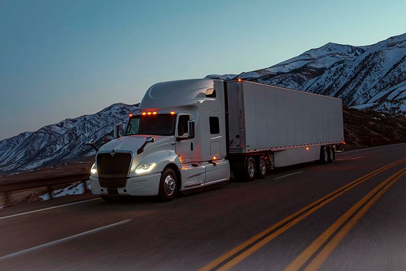 ELEMARI truck on a mountain highway at dusk