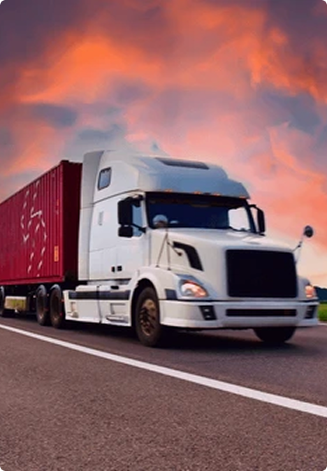 ELEMARI truck hauling a container under a sunset sky