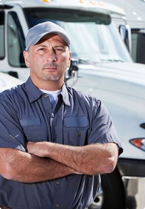 ELEMARI driver standing in front of a white truck
